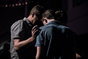 men touching each other's foreheads