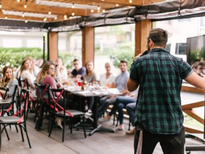 man standing infront of group of people