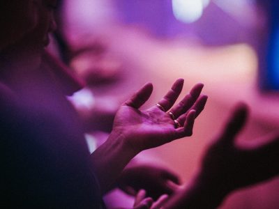 person raising his left hand